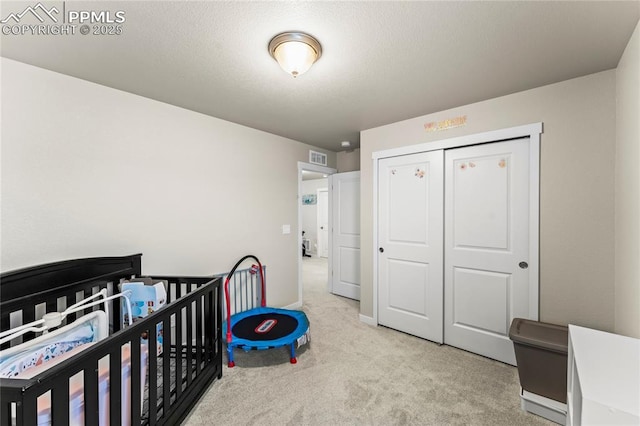 carpeted bedroom with a closet