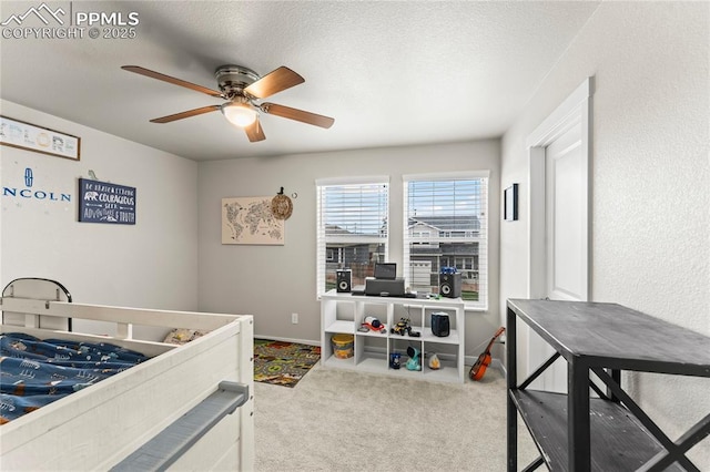 bedroom featuring a ceiling fan, baseboards, carpet, and a textured ceiling