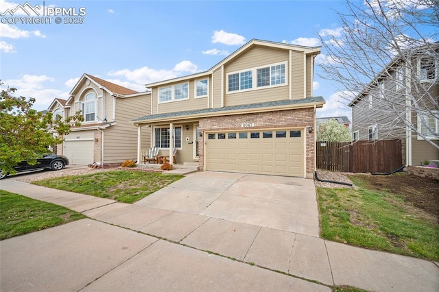 view of front of home with brick siding, a garage, fence, and concrete driveway