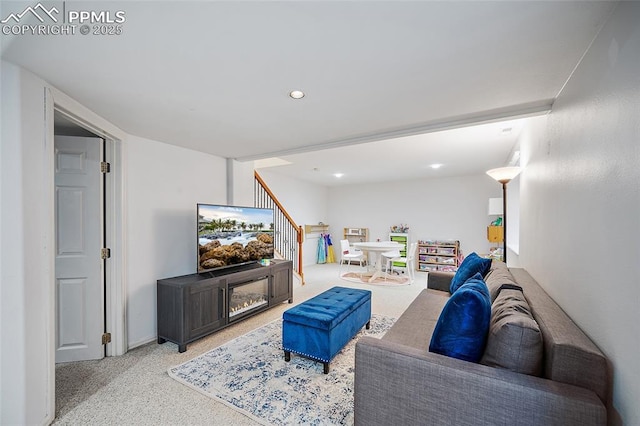 carpeted living room featuring recessed lighting, stairs, and baseboards