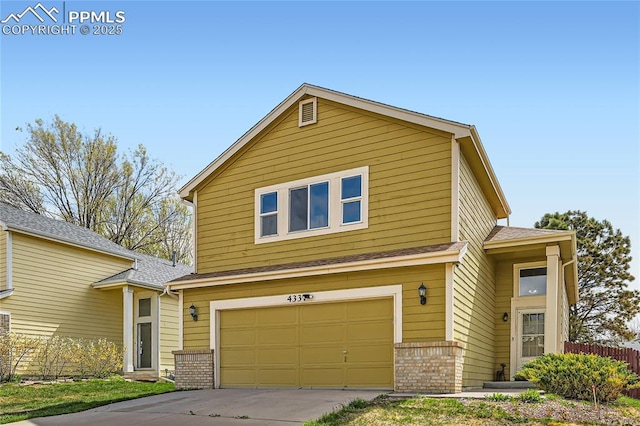 4337 Levi Ln, Colorado Springs, CO 80925 - view of front facade featuring fence, an attached garage, driveway, and brick siding