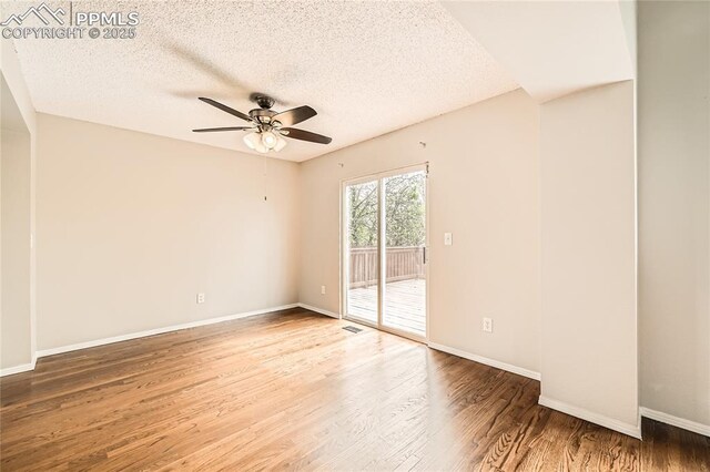 4337 Levi Ln, Colorado Springs, CO 80925 - spare room with baseboards, a textured ceiling, ceiling fan, and wood finished floors