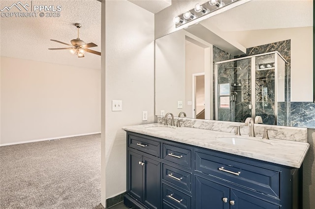 4337 Levi Ln, Colorado Springs, CO 80925 - full bath with double vanity, ceiling fan, a sink, and a stall shower