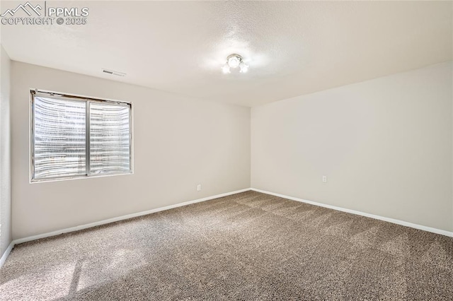 4337 Levi Ln, Colorado Springs, CO 80925 - carpeted spare room featuring visible vents, a textured ceiling, and baseboards