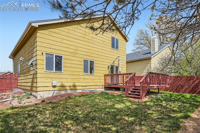 4337 Levi Ln, Colorado Springs, CO 80925 - rear view of property with fence, a yard, and a deck