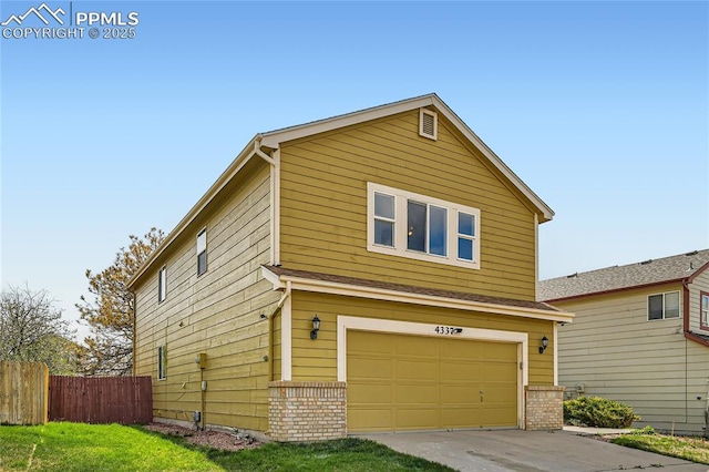 4337 Levi Ln, Colorado Springs, CO 80925 - traditional-style house featuring fence, driveway, and a garage