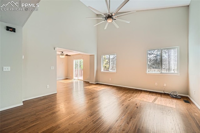 4337 Levi Ln, Colorado Springs, CO 80925 - spare room featuring a ceiling fan, visible vents, wood finished floors, high vaulted ceiling, and baseboards
