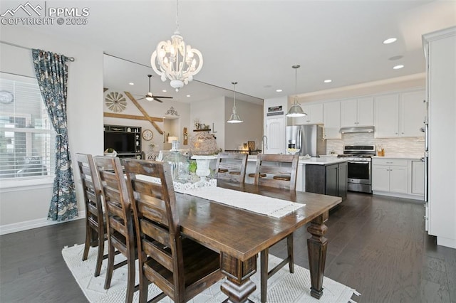 dining area with dark wood-style flooring, recessed lighting, baseboards, and ceiling fan with notable chandelier