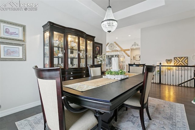 dining space featuring recessed lighting, baseboards, a chandelier, and wood finished floors