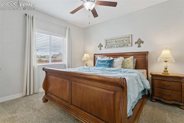 bedroom with a ceiling fan, baseboards, and light carpet
