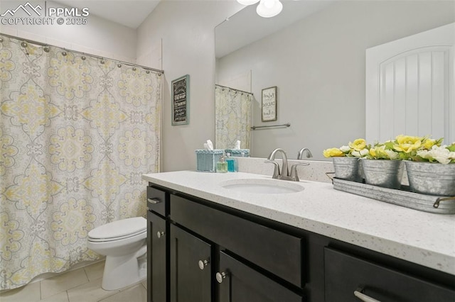 bathroom with vanity, tile patterned floors, toilet, and a shower with curtain