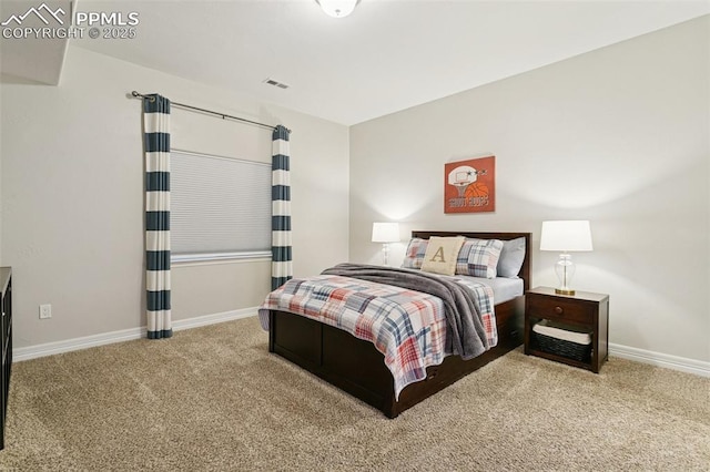 bedroom with carpet flooring, baseboards, and visible vents