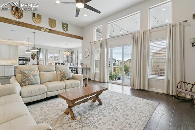 living area featuring baseboards, recessed lighting, dark wood finished floors, and ceiling fan