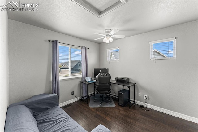 office space with baseboards, a textured ceiling, ceiling fan, and wood finished floors