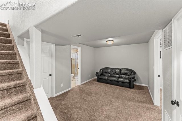 sitting room with stairs, baseboards, visible vents, and carpet