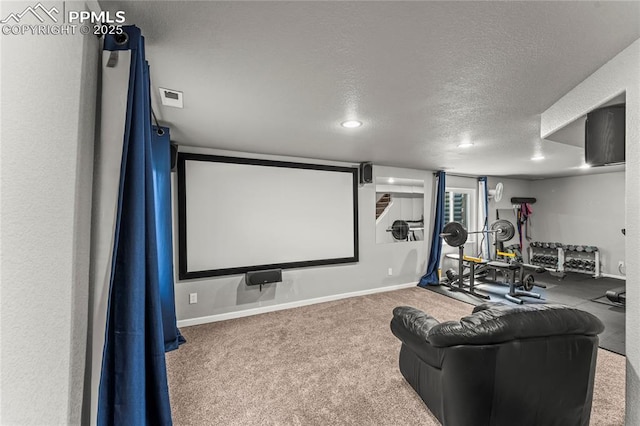 carpeted home theater room with recessed lighting, a textured ceiling, visible vents, and baseboards