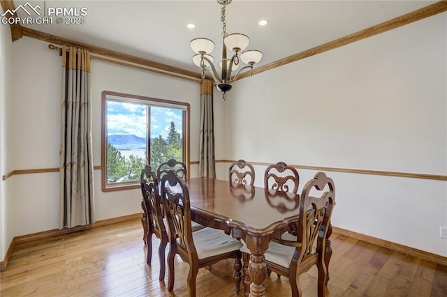 dining space with a chandelier, light wood-type flooring, ornamental molding, baseboards, and recessed lighting