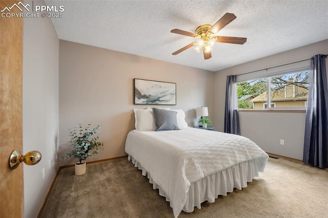6277 Gunshot Pass Dr, Colorado Springs, CO 80917 - carpeted bedroom featuring baseboards, a textured ceiling, and a ceiling fan