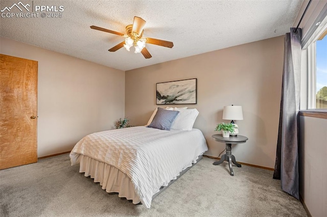 6277 Gunshot Pass Dr, Colorado Springs, CO 80917 - bedroom featuring carpet flooring, baseboards, ceiling fan, and a textured ceiling