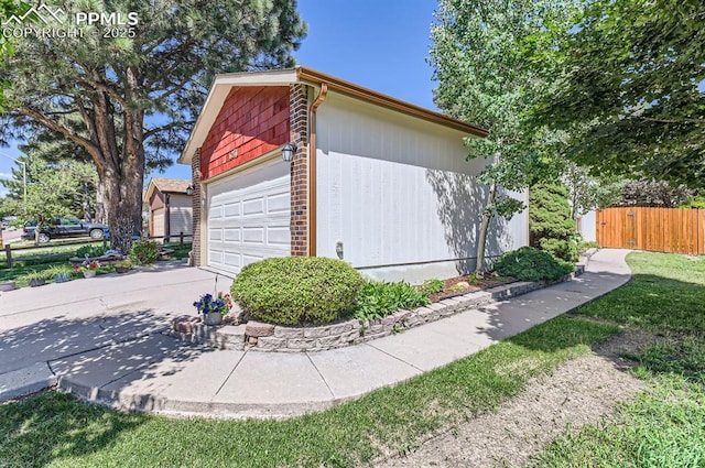 6277 Gunshot Pass Dr, Colorado Springs, CO 80917 - garage featuring fence and driveway