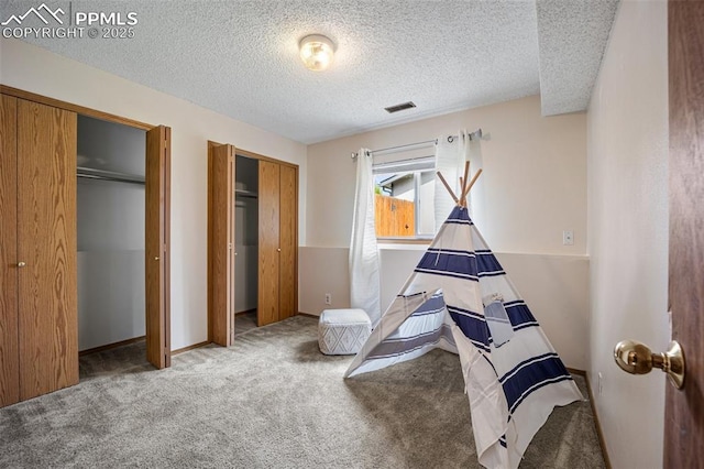 6277 Gunshot Pass Dr, Colorado Springs, CO 80917 - game room with carpet flooring, a textured ceiling, and baseboards