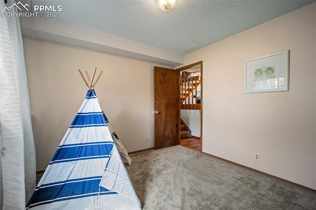 6277 Gunshot Pass Dr, Colorado Springs, CO 80917 - unfurnished bedroom with carpet flooring, baseboards, and a textured ceiling