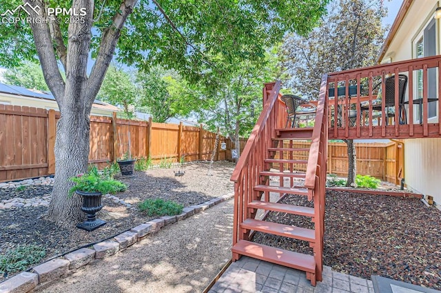 6277 Gunshot Pass Dr, Colorado Springs, CO 80917 - fenced backyard featuring stairs and a deck