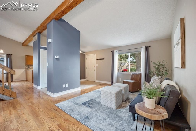 6277 Gunshot Pass Dr, Colorado Springs, CO 80917 - living area featuring light wood-style flooring, stairway, and baseboards
