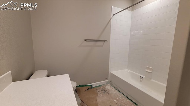 10630 Wolf Lake Dr, Colorado Springs, CO 80924 - bathroom with toilet, baseboards, and shower / bath combination