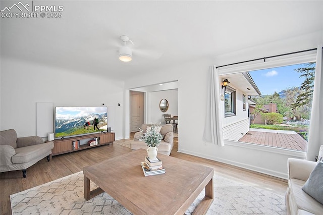 137 N 14th St, Colorado Springs, CO 80904 - living room with baseboards, ceiling fan, and wood finished floors