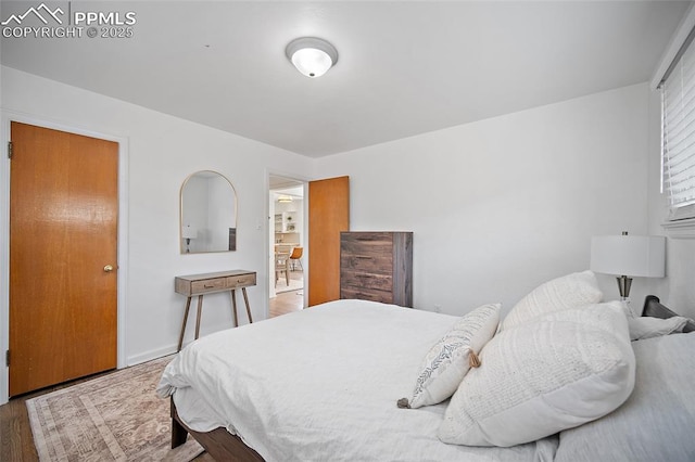 137 N 14th St, Colorado Springs, CO 80904 - bedroom featuring baseboards and wood finished floors