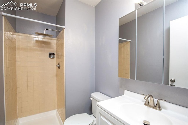 1950 Rusty Hinge Dr, Colorado Springs, CO 80920 - bathroom featuring tiled shower, toilet, and vanity