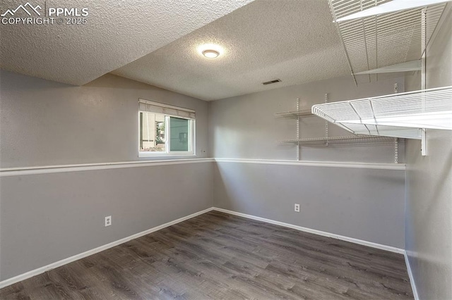 1950 Rusty Hinge Dr, Colorado Springs, CO 80920 - basement featuring wood finished floors, a textured ceiling, and baseboards