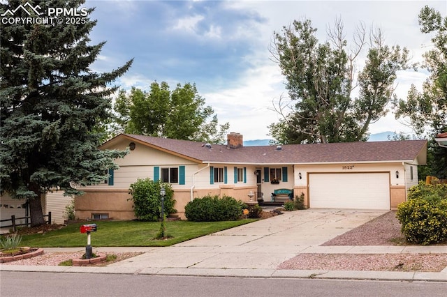 1522 Lehmberg Blvd, Colorado Springs, CO 80915 - ranch-style house with an attached garage, driveway, a chimney, and a front yard