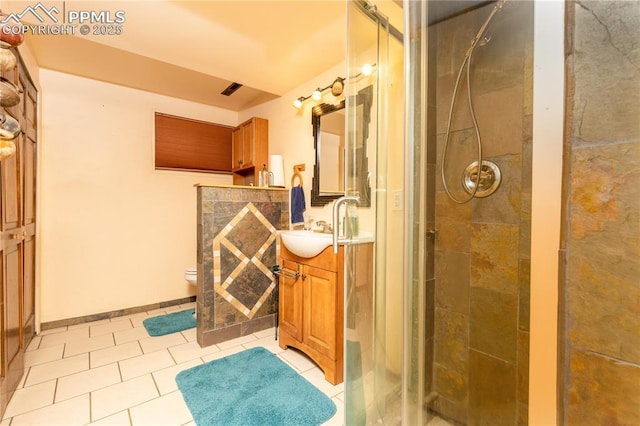 1522 Lehmberg Blvd, Colorado Springs, CO 80915 - bathroom featuring a shower stall, vanity, and tile patterned flooring