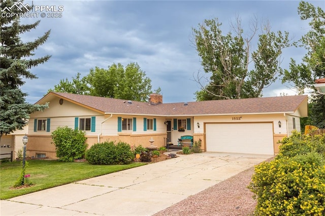 1522 Lehmberg Blvd, Colorado Springs, CO 80915 - ranch-style house featuring a garage, driveway, a chimney, a front yard, and a shingled roof