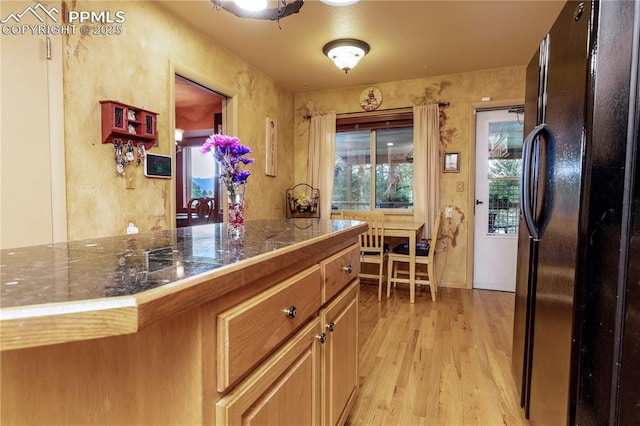 1522 Lehmberg Blvd, Colorado Springs, CO 80915 - kitchen with freestanding refrigerator, light wood finished floors, and tile countertops