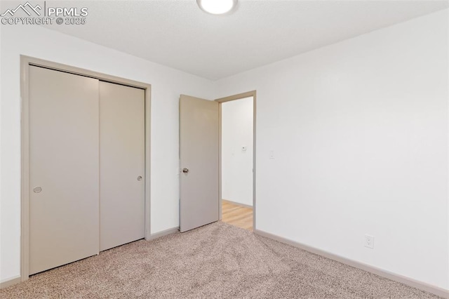 929 Bromefield Dr, Fountain, CO 80817 - unfurnished bedroom with light colored carpet, baseboards, and a closet