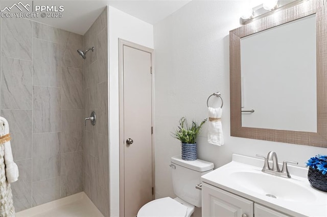 929 Bromefield Dr, Fountain, CO 80817 - bathroom featuring toilet, tiled shower, and vanity