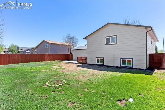 929 Bromefield Dr, Fountain, CO 80817 - rear view of house featuring a lawn and a fenced backyard