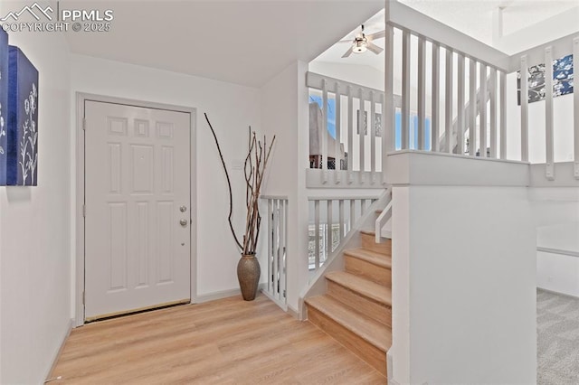 929 Bromefield Dr, Fountain, CO 80817 - entryway featuring baseboards, a ceiling fan, stairs, and wood finished floors