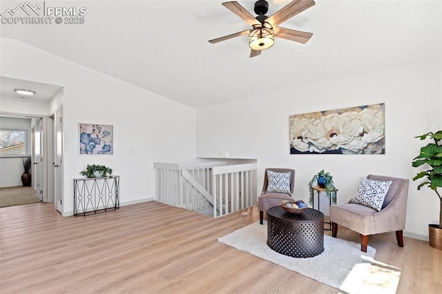 929 Bromefield Dr, Fountain, CO 80817 - living area with ceiling fan, an upstairs landing, wood finished floors, and vaulted ceiling
