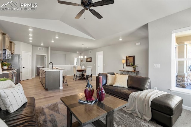 9484 Simper Hts, Colorado Springs, CO 80924 - living area featuring vaulted ceiling, recessed lighting, a ceiling fan, light wood-style flooring, and baseboards