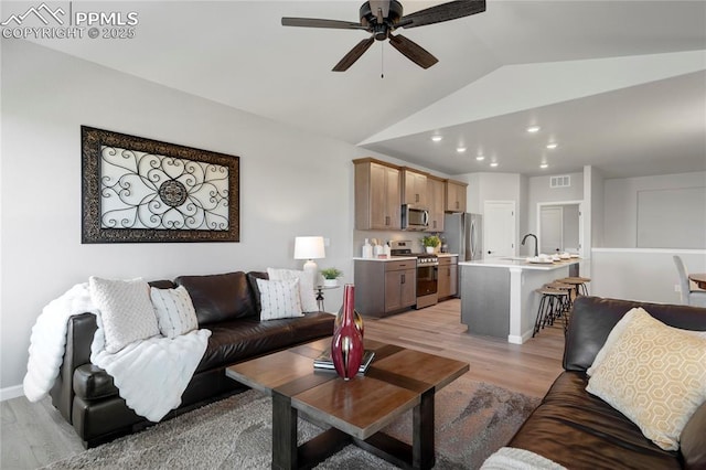 9484 Simper Hts, Colorado Springs, CO 80924 - living room featuring light wood-style floors, vaulted ceiling, a ceiling fan, and recessed lighting