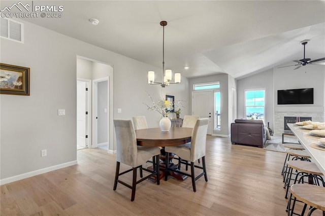 9484 Simper Hts, Colorado Springs, CO 80924 - dining area with light wood-style floors, baseboards, ceiling fan, and lofted ceiling