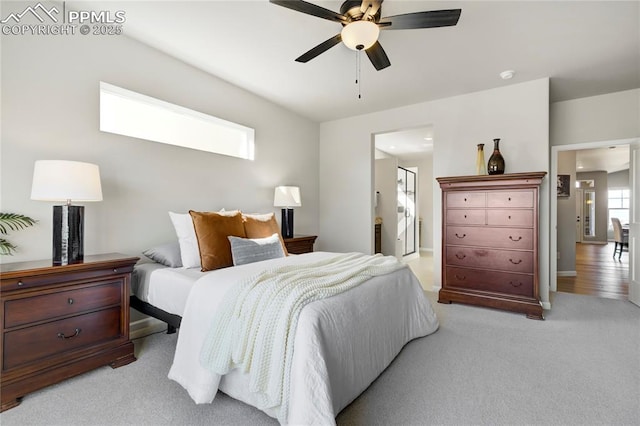 9484 Simper Hts, Colorado Springs, CO 80924 - bedroom featuring light carpet, connected bathroom, and ceiling fan