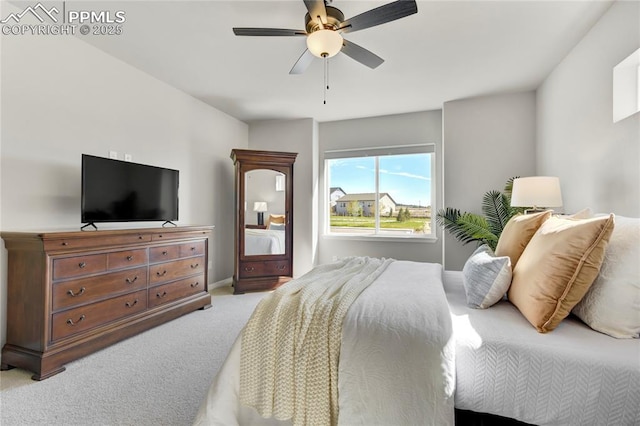 9484 Simper Hts, Colorado Springs, CO 80924 - bedroom featuring light carpet, a ceiling fan, and baseboards