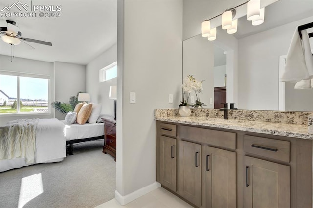 9484 Simper Hts, Colorado Springs, CO 80924 - ensuite bathroom with vanity, ceiling fan, and baseboards