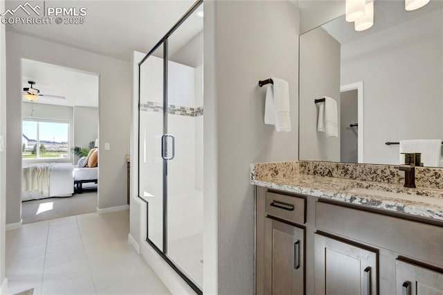 9484 Simper Hts, Colorado Springs, CO 80924 - bathroom featuring ensuite bath, a stall shower, vanity, ceiling fan, and baseboards