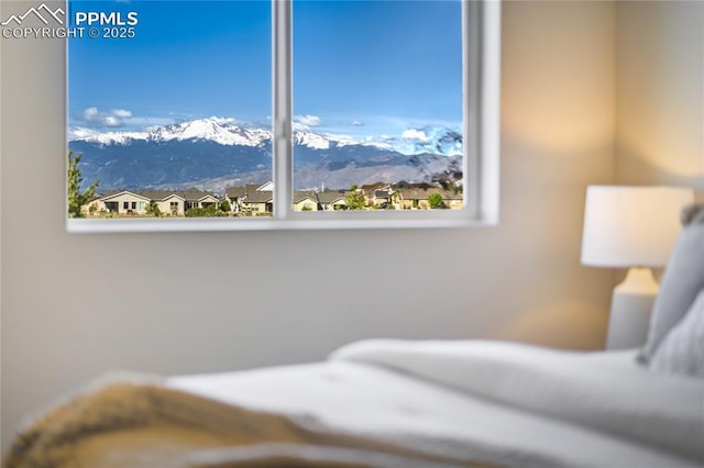 9484 Simper Hts, Colorado Springs, CO 80924 - bedroom with multiple windows and a mountain view